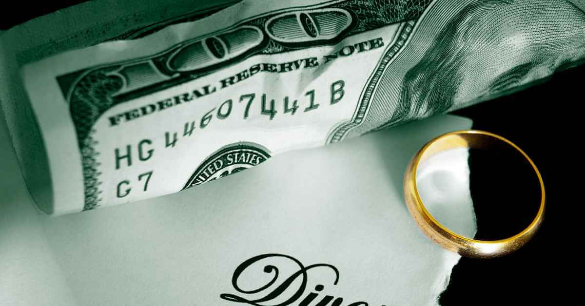 A $100 bill, a wedding ring, and a torn divorce paper