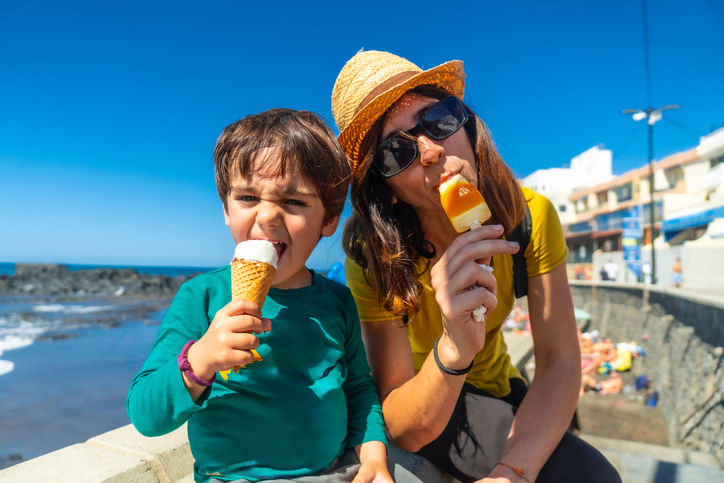 mother and son eating ice cream outside